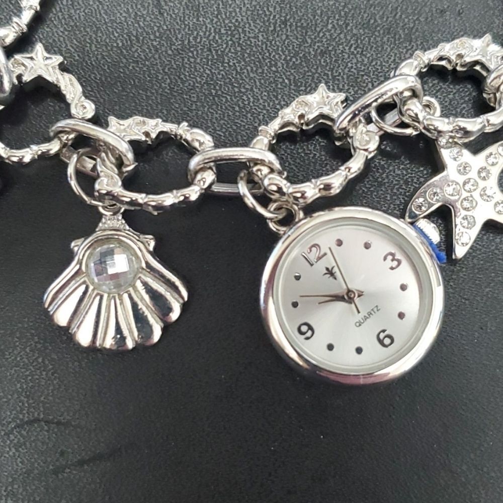 Silver tone beach themed charm bracelet watch needs battery